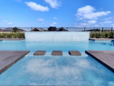 A pool and spa combo with the X Trainer swimming pool and 3 water walls