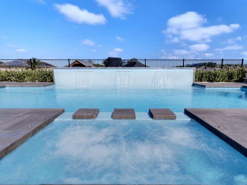 A pool and spa combo with the X Trainer swimming pool and 3 water walls