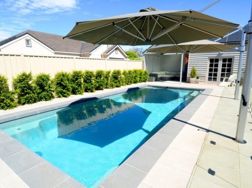 A self cleaning Compass fibreglass pool X Trainer