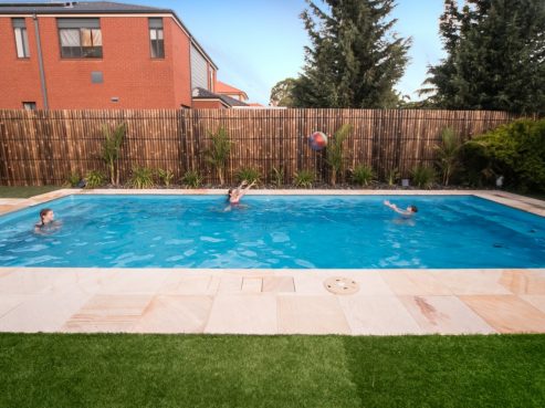 Compass Pools Contemporary swimming pool ideal for water games