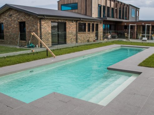 Compass Pools Beautiful Fastlane lap pool with external steps