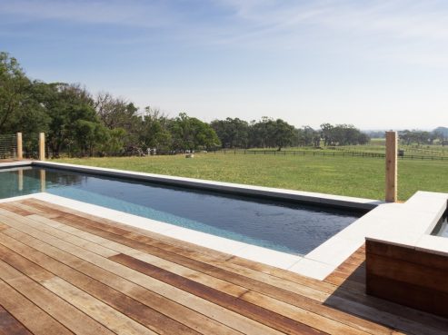 Compass Pools Fastlane pool and spa combo with a timber decking