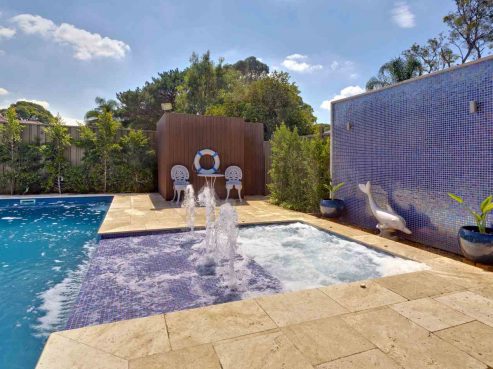 Sunpod water feature connecting a spa to the pool
