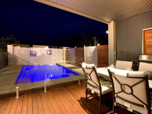 X Trainer fibreglass pool in a compact backyard