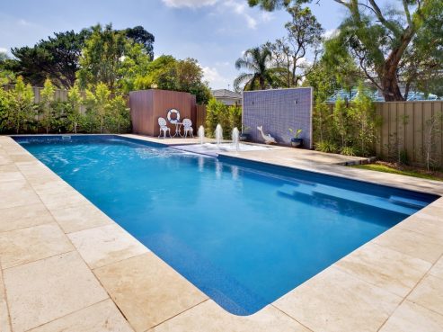 X Trainer fibreglass pool with a spa attached via a Sunpod water feature
