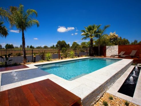 X Trainer pool build partially above the ground with water features