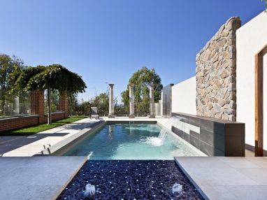 X Trainer swimming pool with a Sunpod bubbler and water wall features