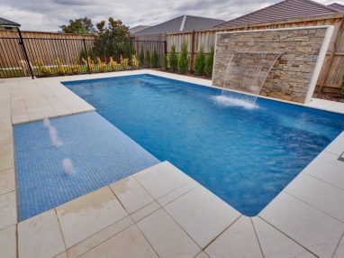 X Trainer swimming pool with a water wall feature and Sunpod