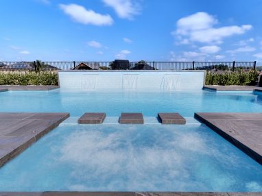 Pool water features: Who would not love this pool and spa combo with three water walls